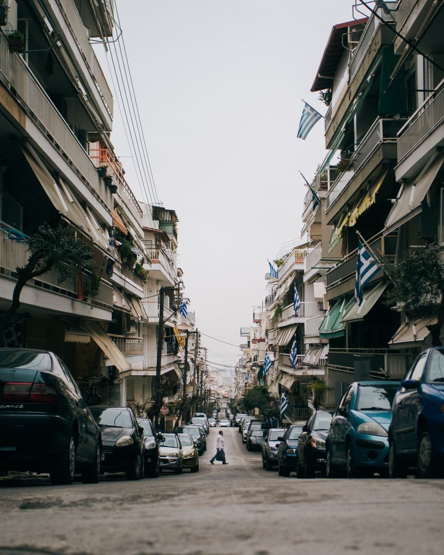 A residential street in Thessaloniki lined with apartment buildings
