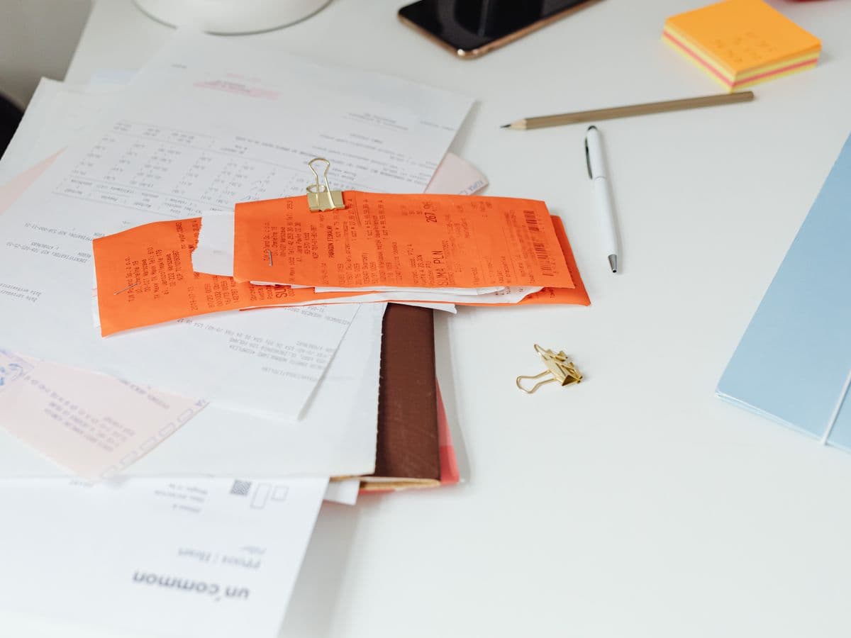 Rent receipts and documents sorted on a desk